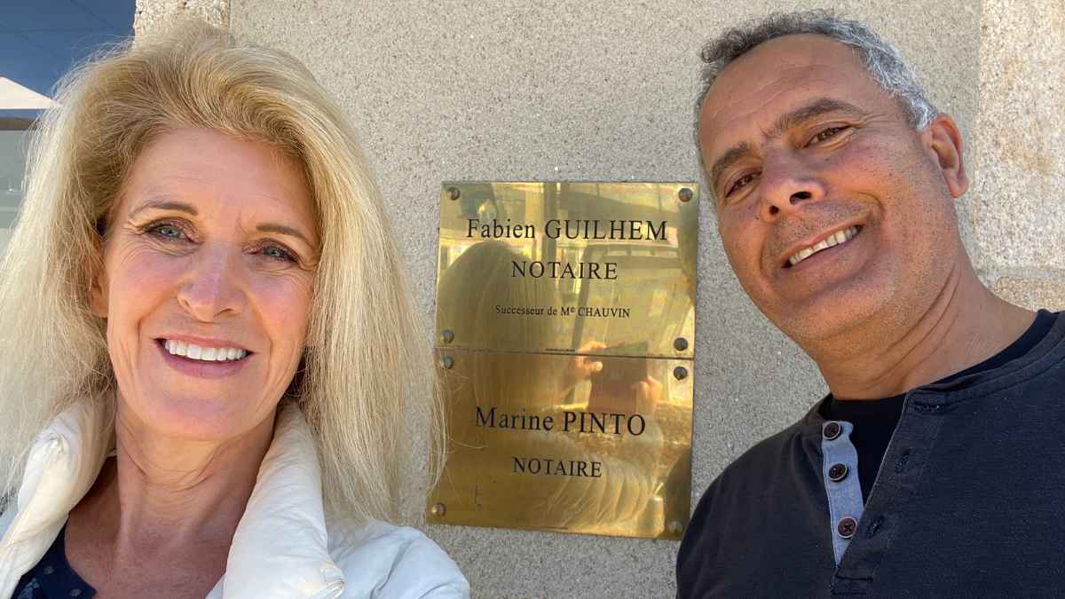 Alison and Zion standing outside a notaire’s office, marking an important moment in the story of Château de la Boutinière and its journey of restoration.