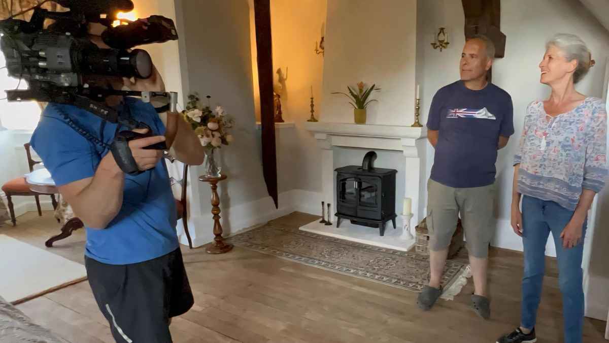 Film crew recording inside the historic interiors of Château de la Boutinière during a behind-the-scenes filming day for a renovation project.