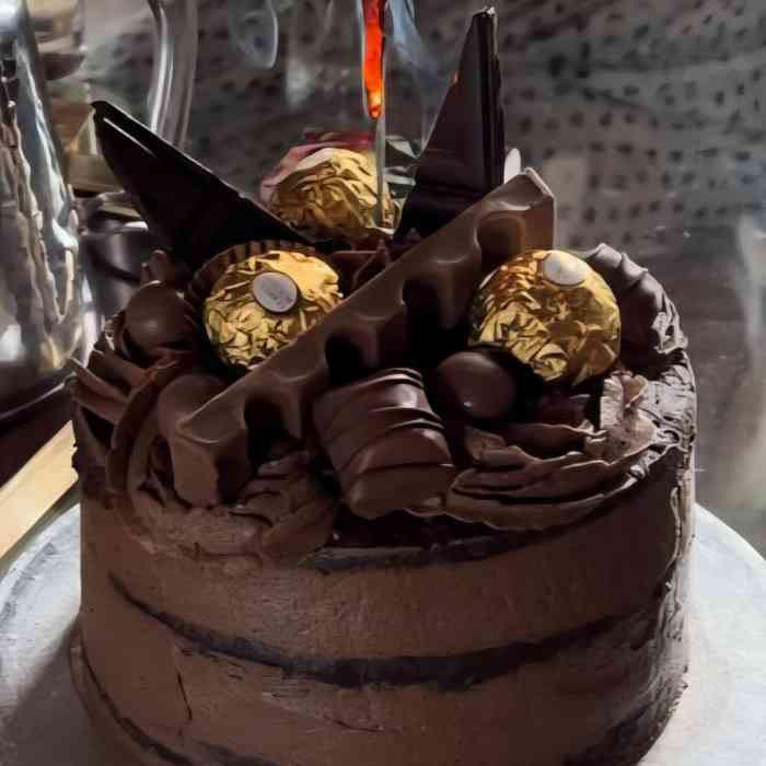 Chocolate celebration cake decorated with chocolates and truffles at Château de la Boutinière.