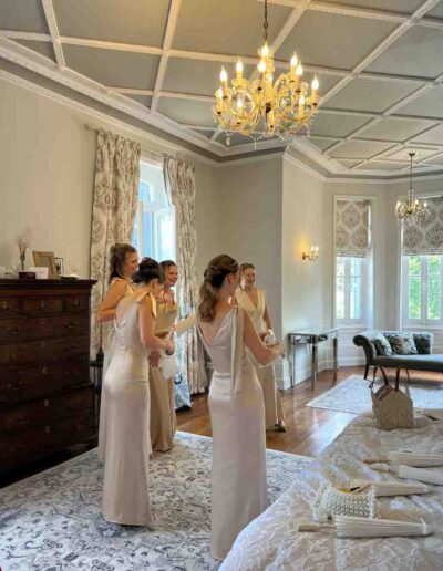 Bridesmaids getting ready together in the spacious bridal suite at Château de la Boutinière.