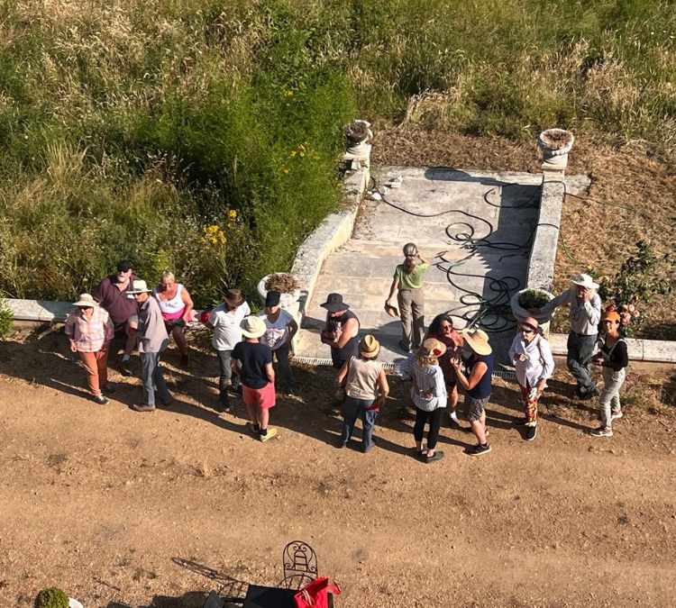 Group of visitors gathered outdoors during Château de la Boutinière Events, enjoying Garden Days activities in the château grounds.