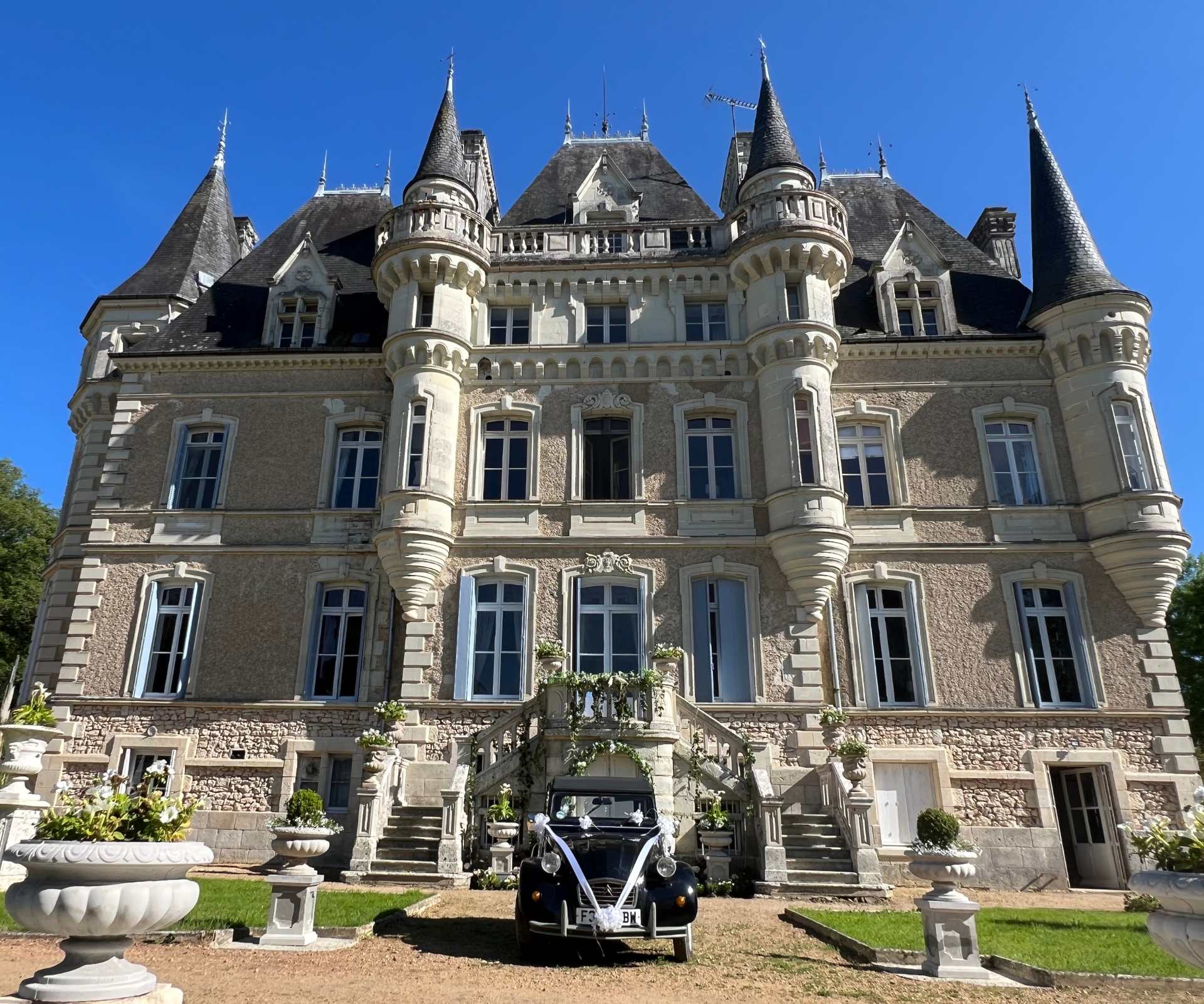 Fairytale wedding at Château de la Boutinière, with the château façade set for a romantic wedding celebration.