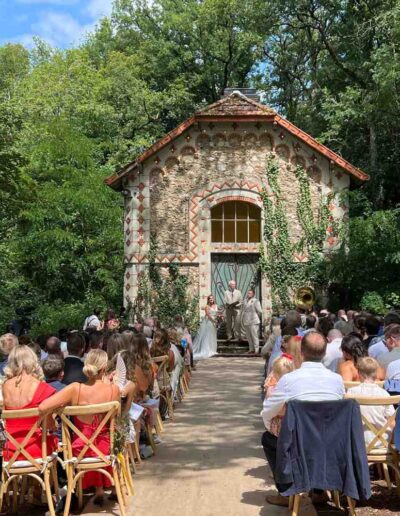 Outdoor fairytale wedding ceremony at the hunting lodge at Château de la Boutinière