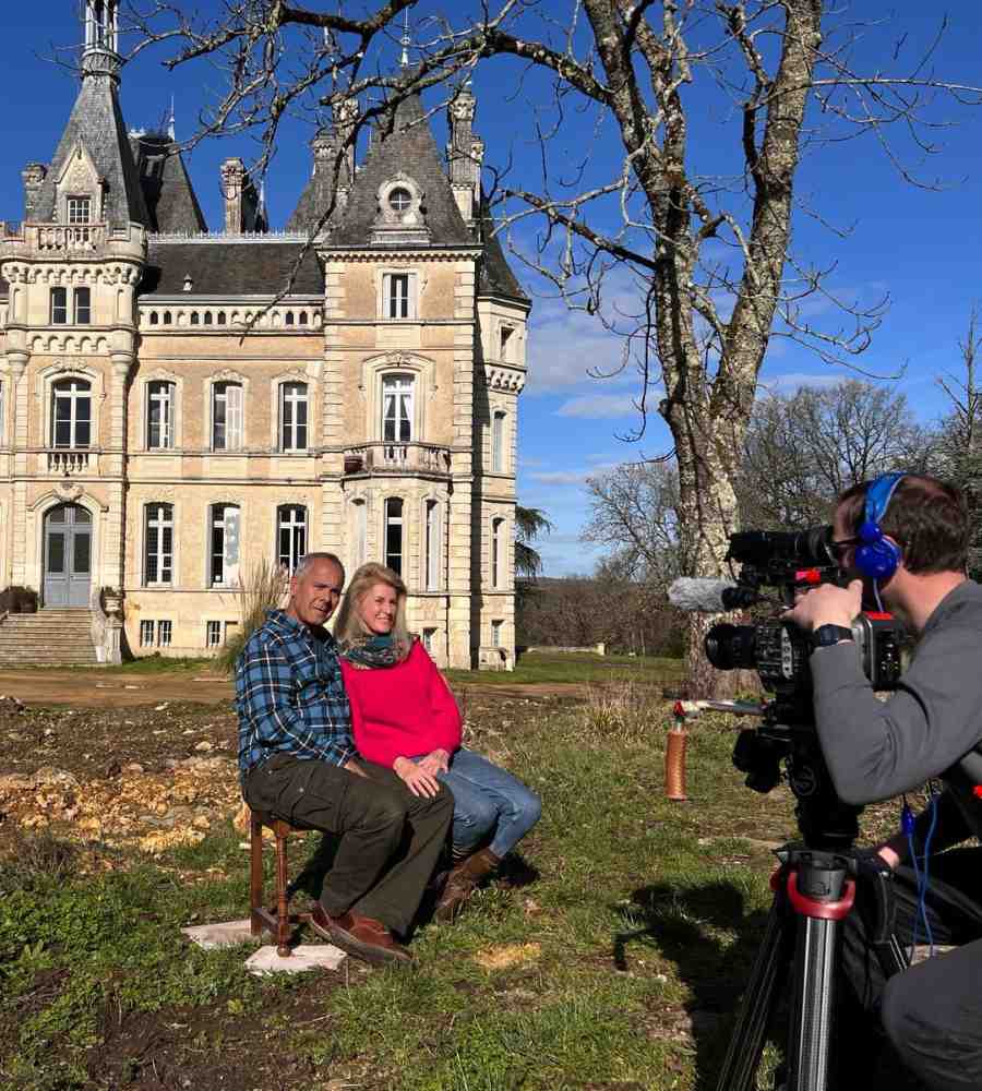 Chateau events filming moment at Château de la Boutinière, showing Alison and Zion being recorded in the château grounds as part of a behind-the-scenes experience.