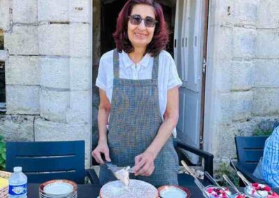 Chateau events gardening day lunch table with homemade cakes and desserts served outside the château entrance.