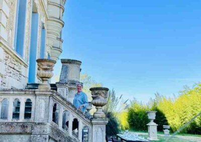 Chateau events gardening day with colourful trays of flowers set out beside the château steps, ready for planting in the garden pots.