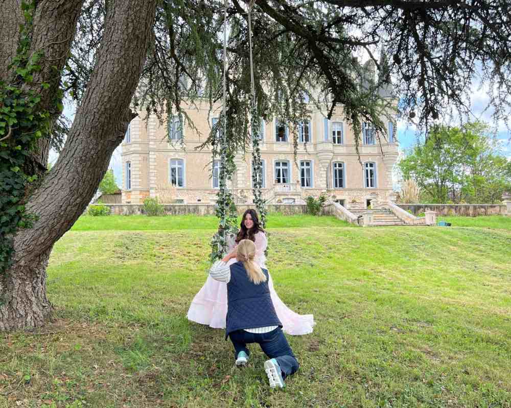 Doreen photographed in front of Château de la Boutinière during a romantic château photoshoot.